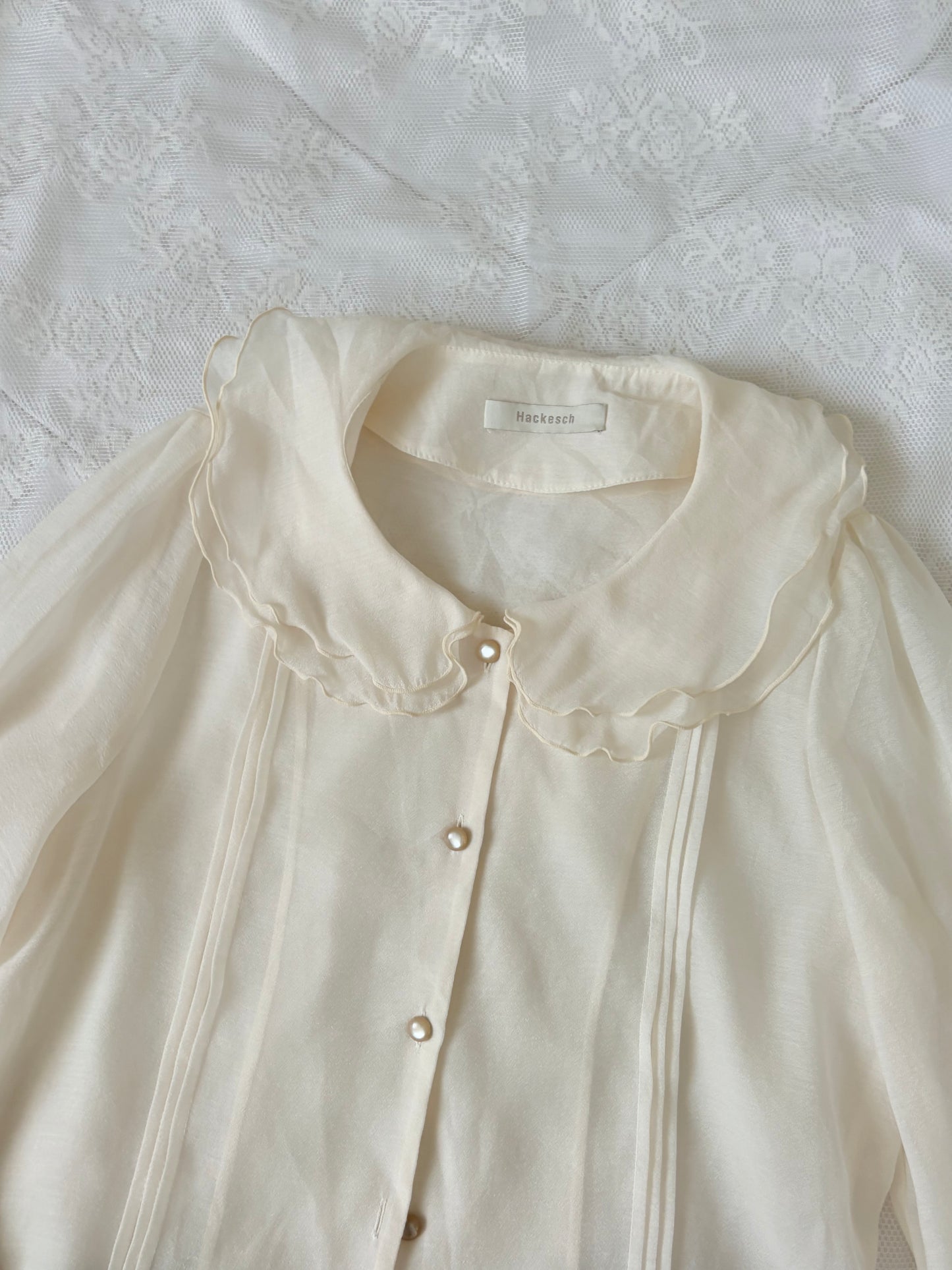 Cream buttoned top