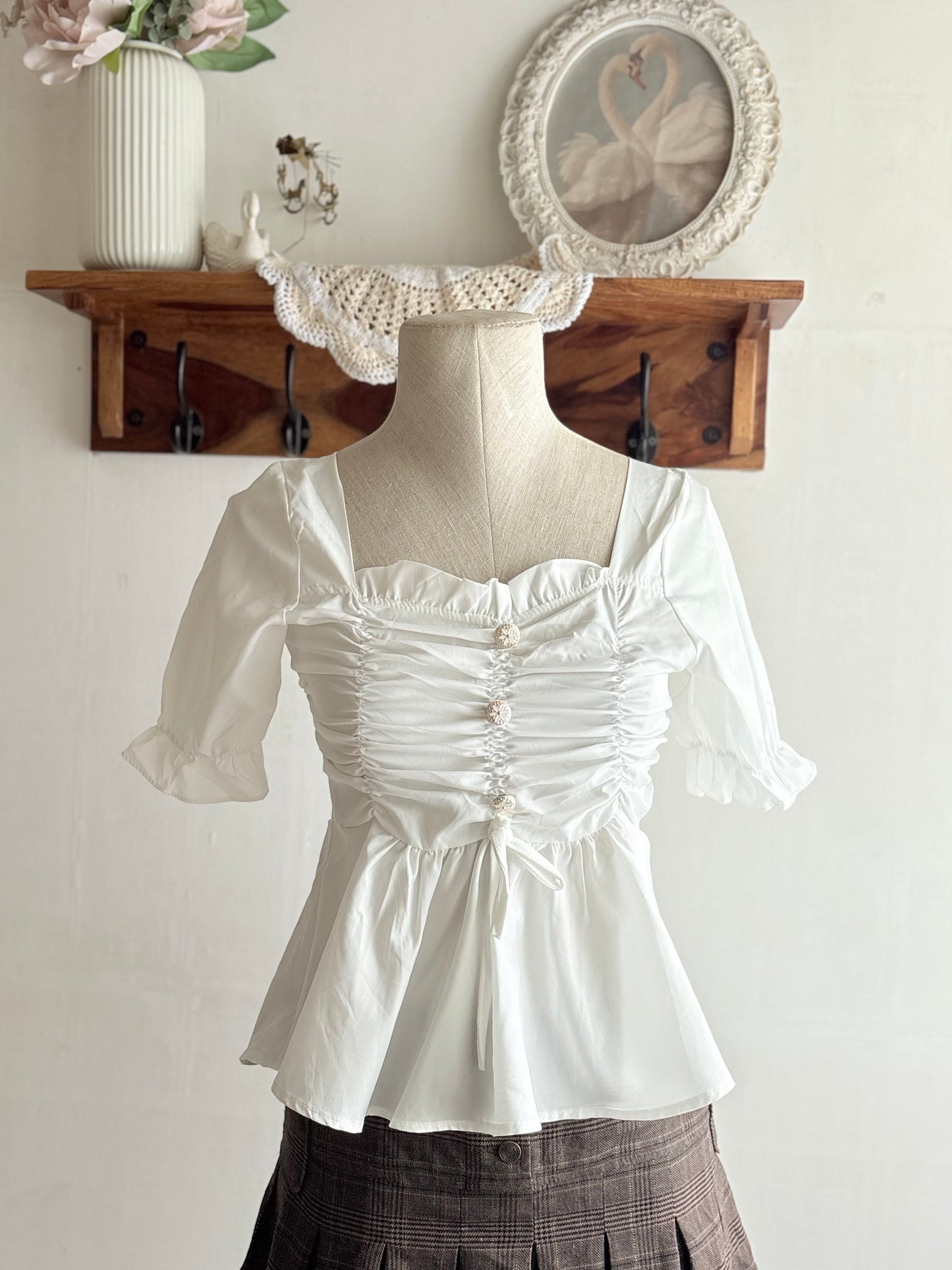 White peplum top