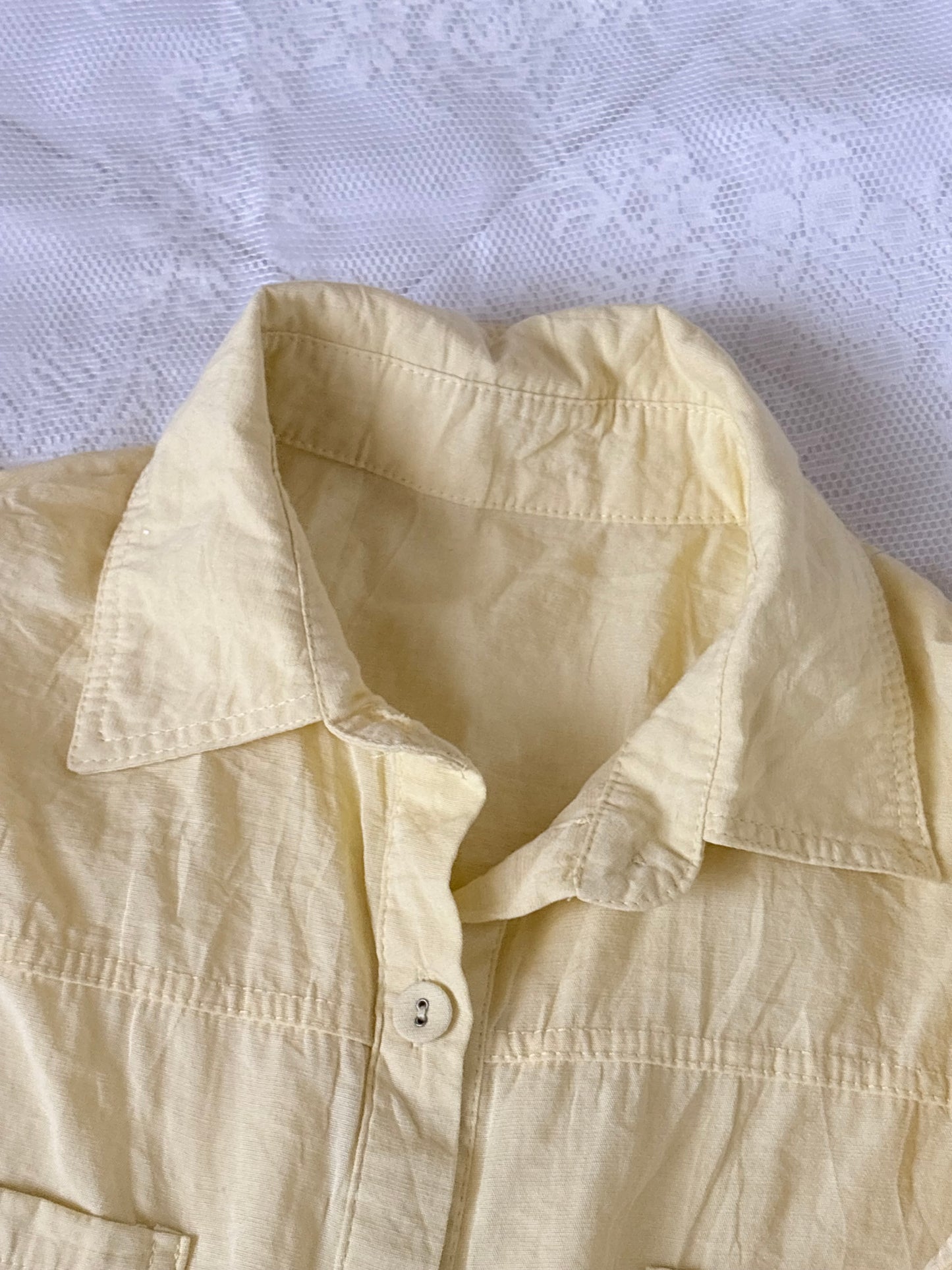 Yellow sleeveless shirt