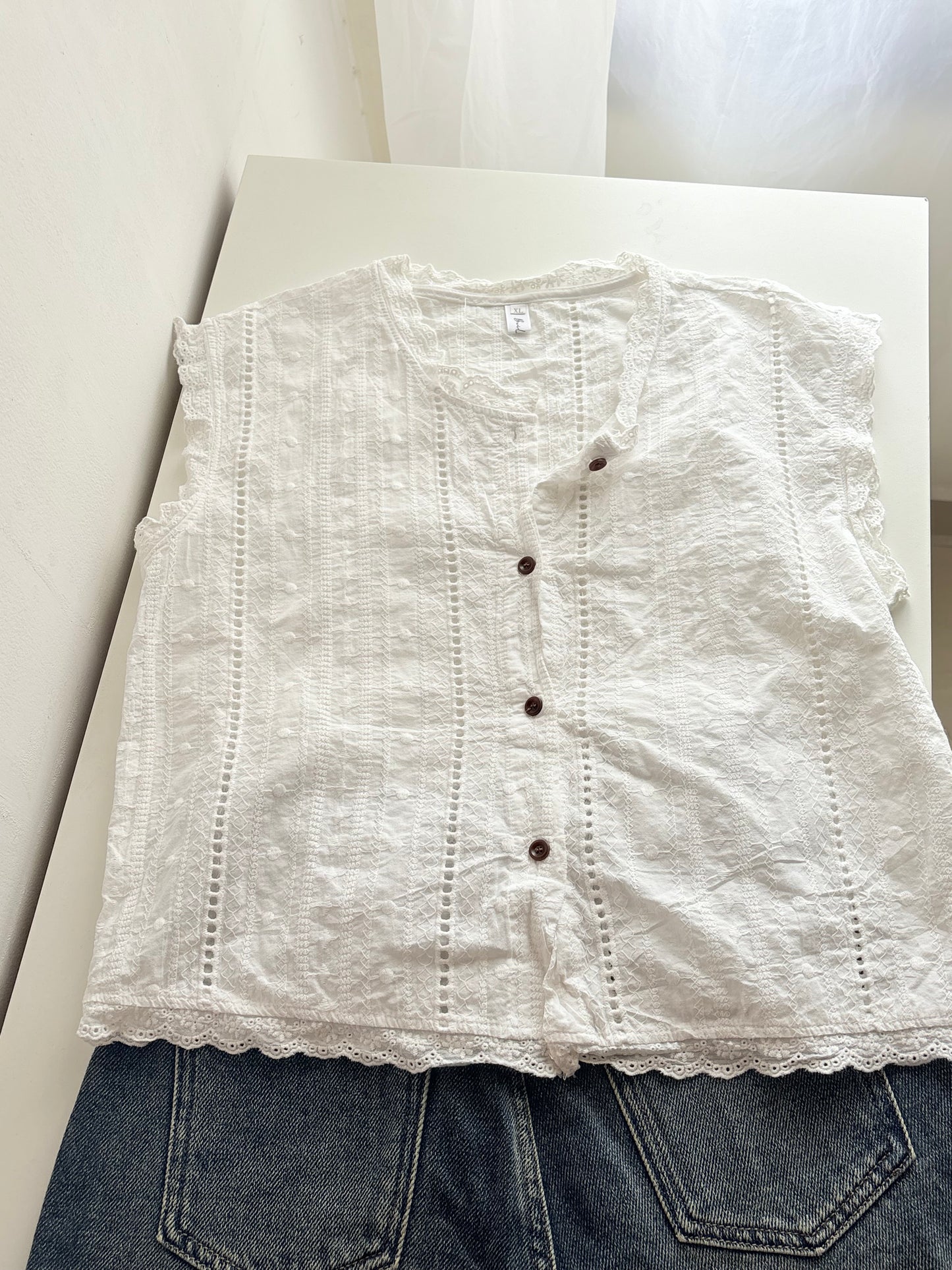 White buttoned top