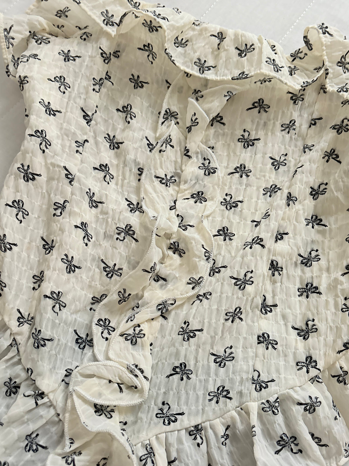 Bow frill top