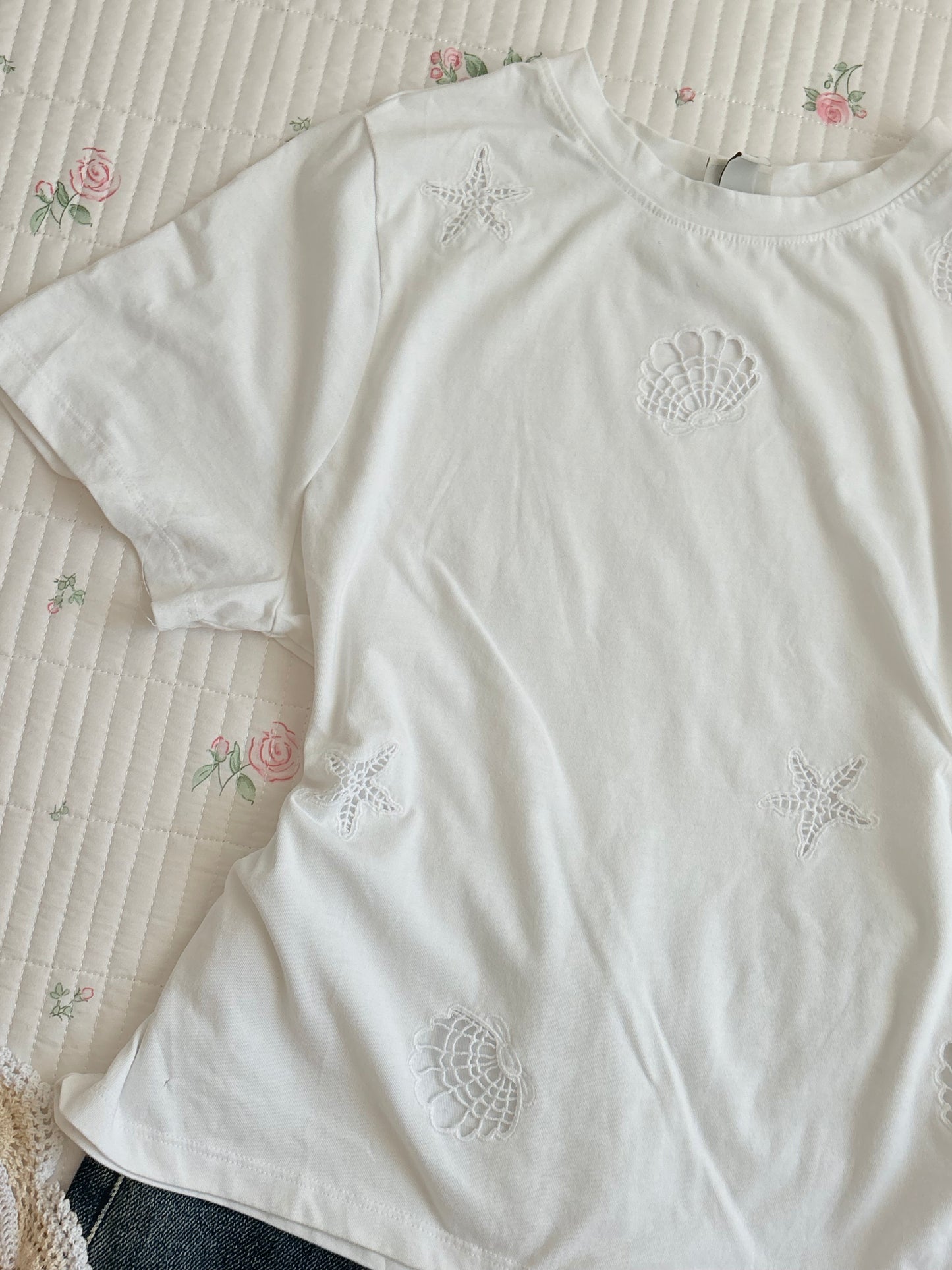 Shell tee