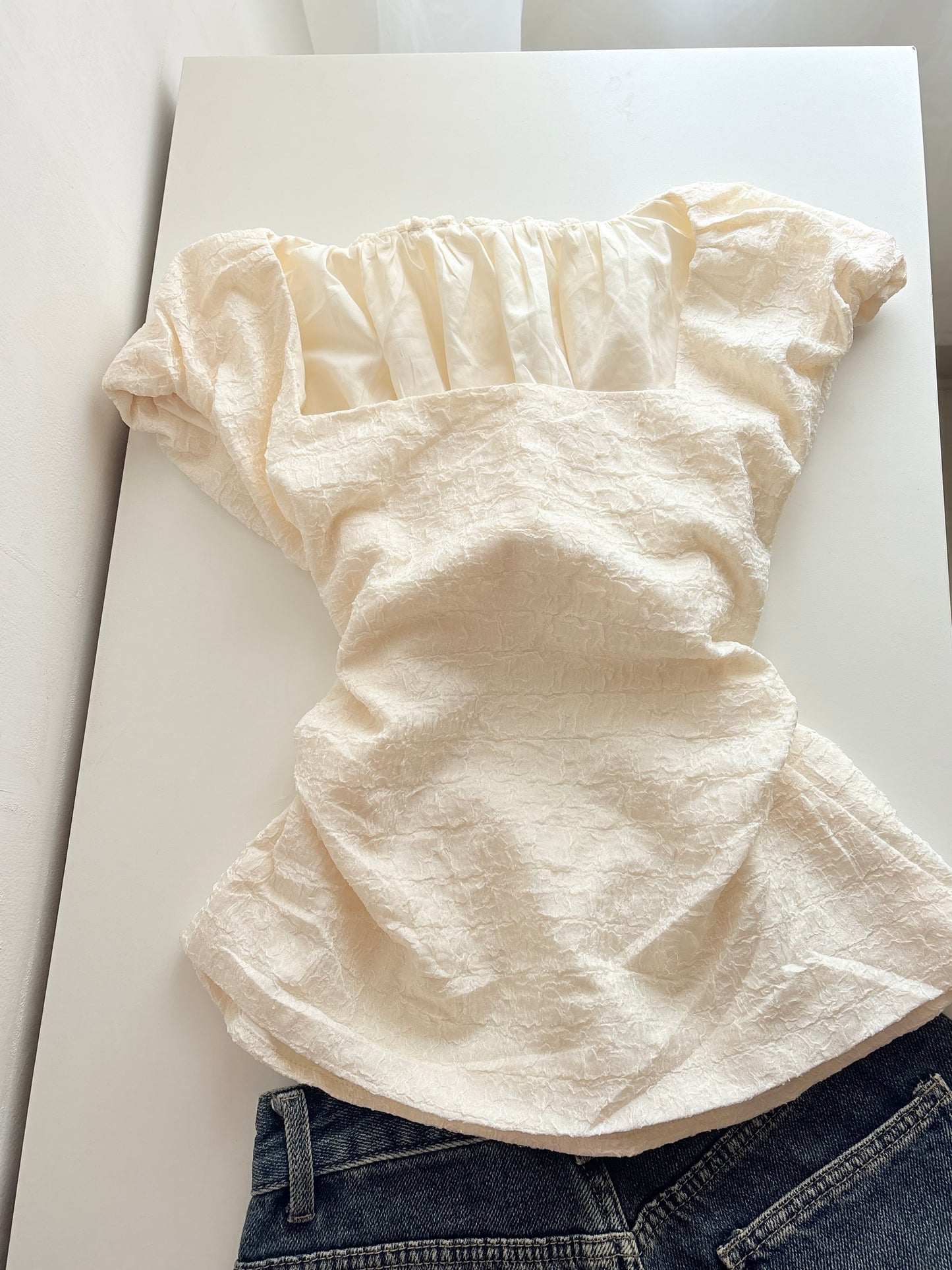 Cream back cut top