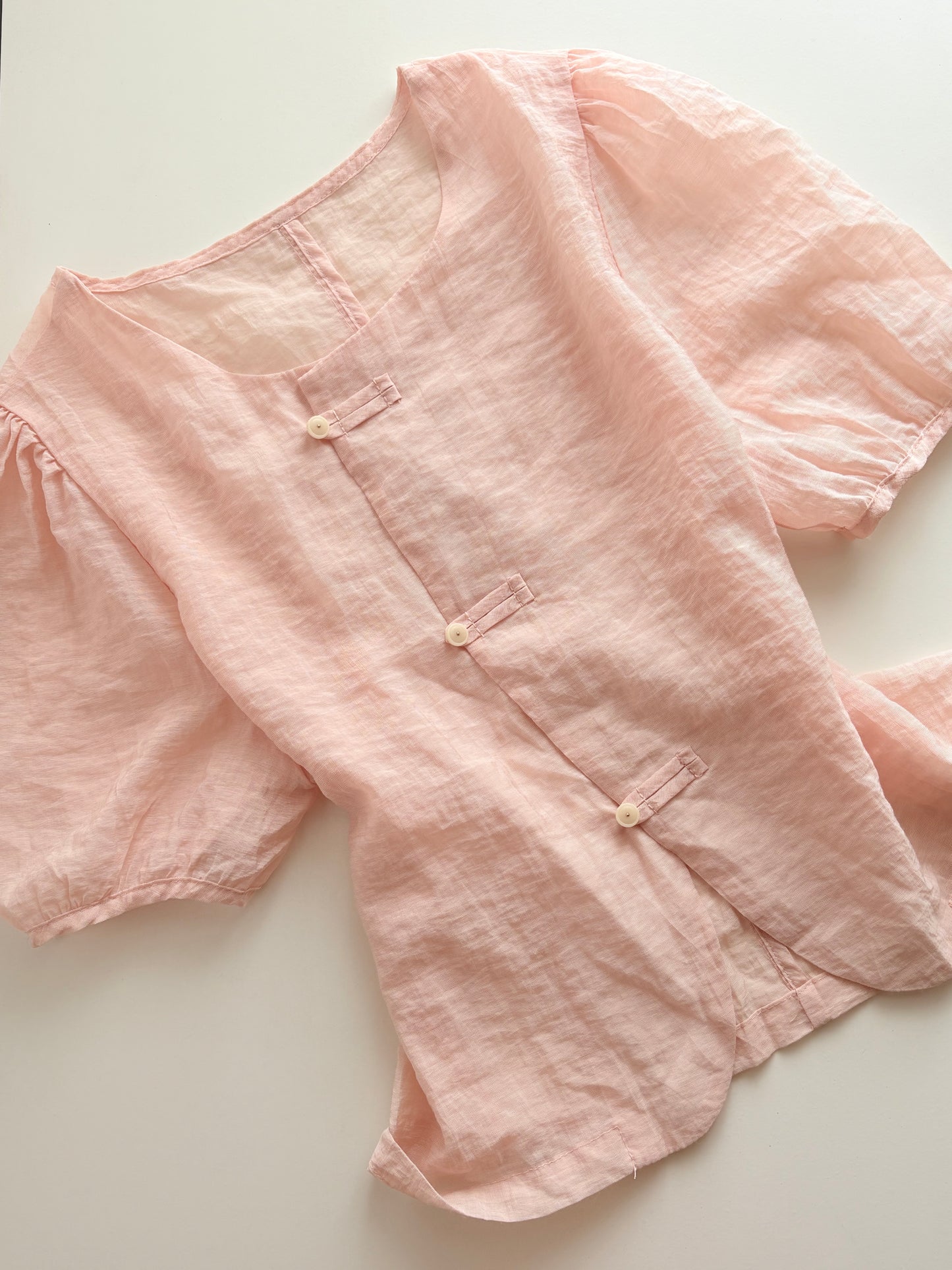Pink buttoned