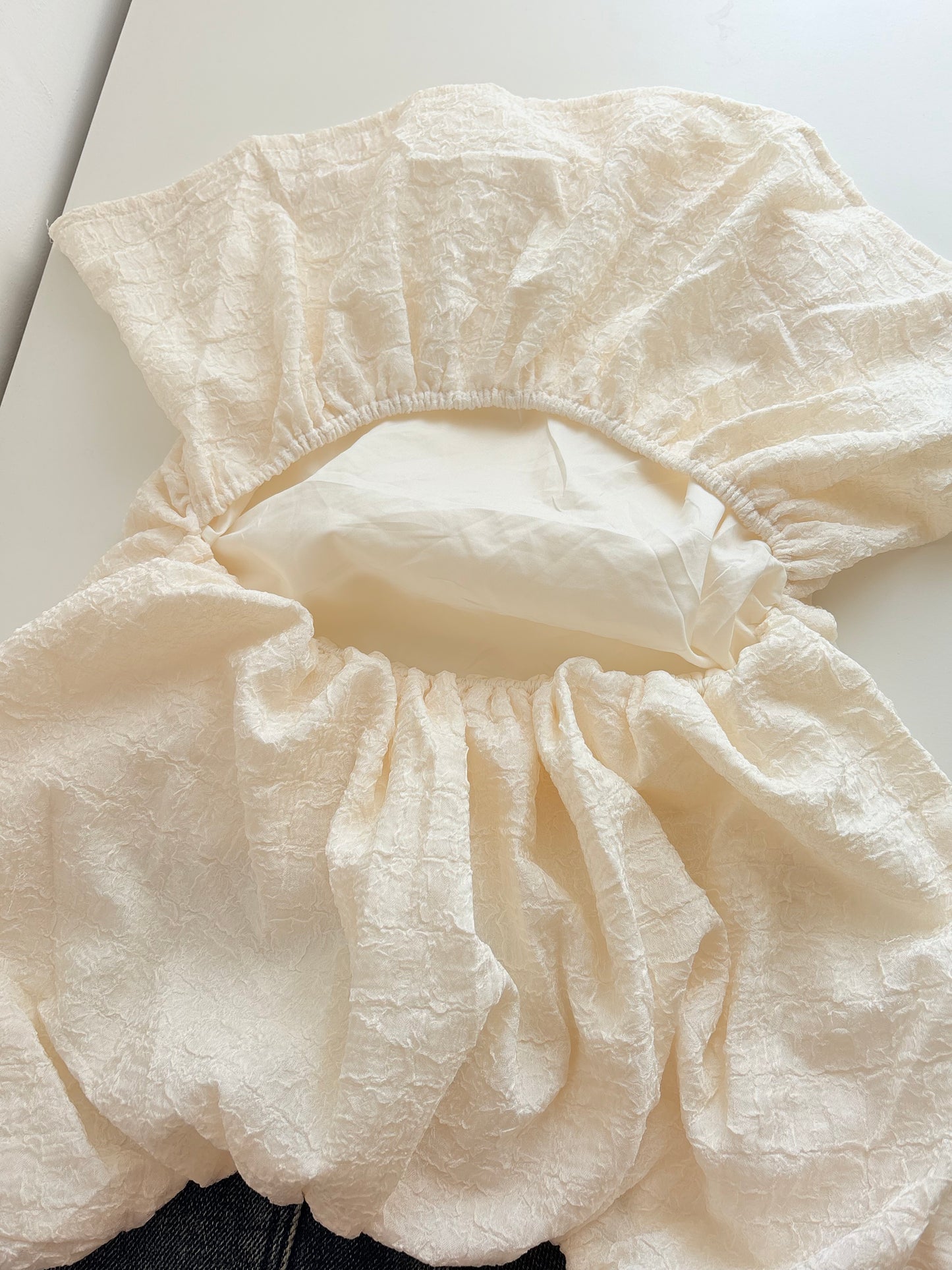 Cream back cut top