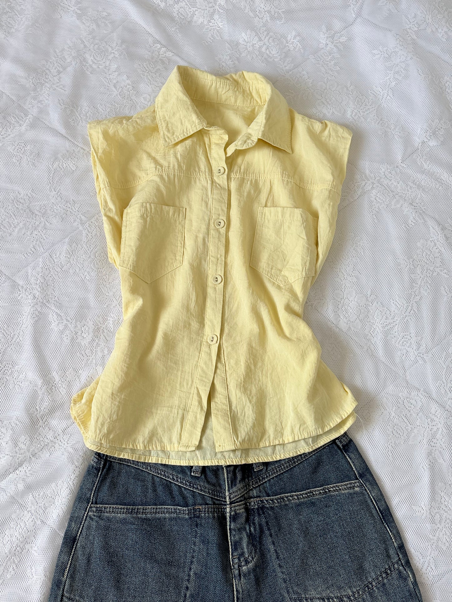 Yellow sleeveless shirt