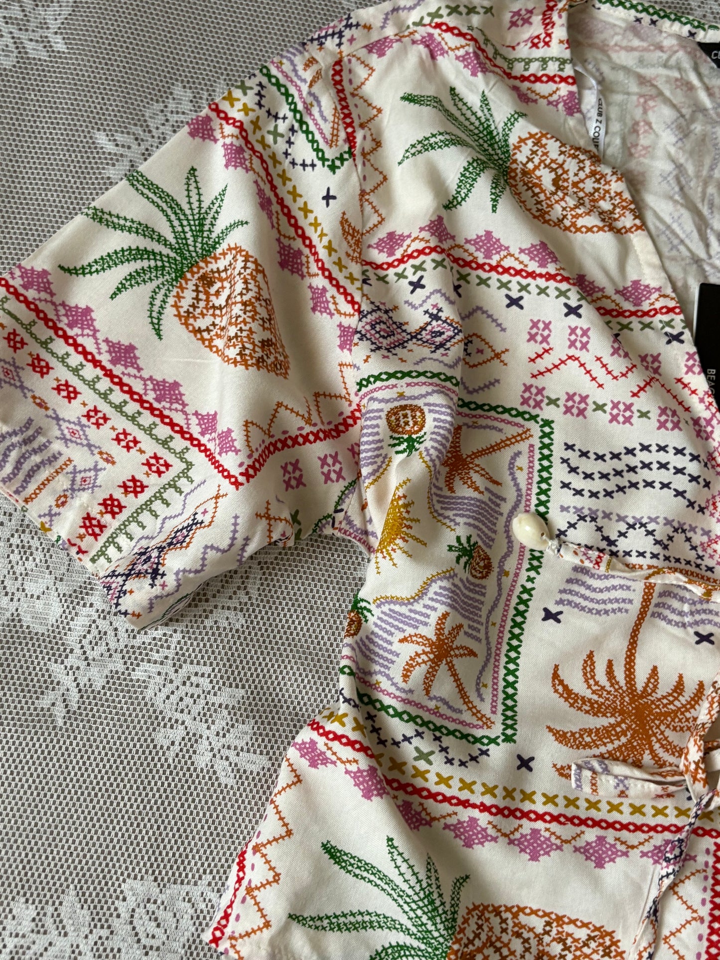 Tropical tie top