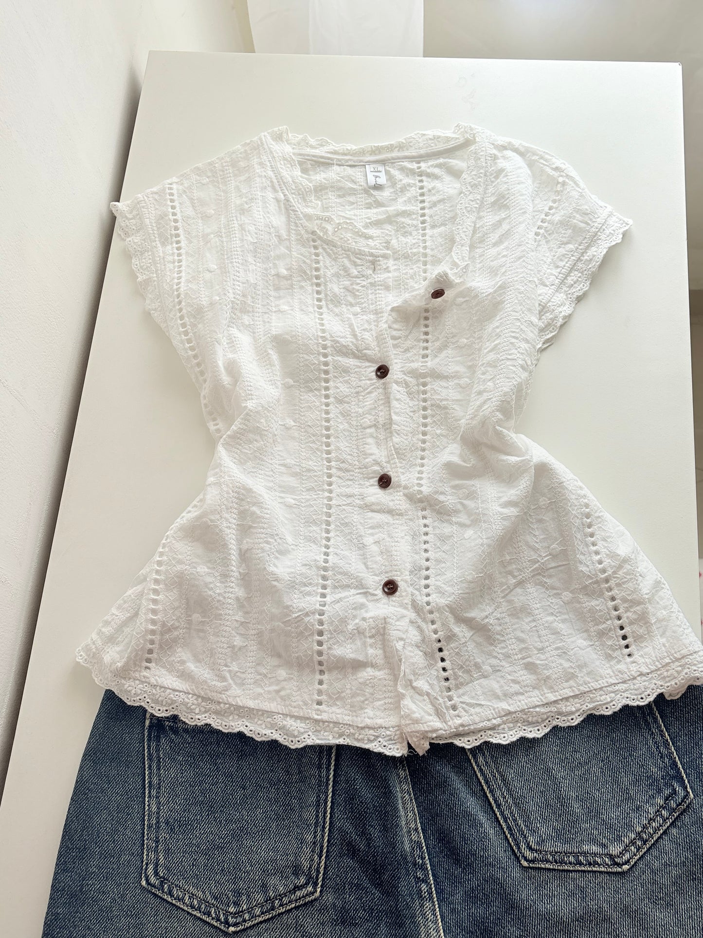 White buttoned top